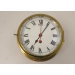 English brass bulkhead clock, white enamelled dial with Roman numerals, centre seconds, lockable