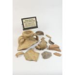 Small selection of Roman fragments, including the base of a Roman sandstone column, 31cm diameter,