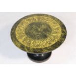 Fornasetti small pedestal table, the circular top decorated with a band of mythological creatures