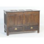 Oak joined mule chest, 18th Century, having a three recessed panel top over a four fielded panel