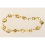 18ct gold bracelet, with open wirework ball links, lobster claw clasp, length 17cm, marked '750',