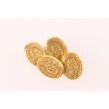 Pair of Victorian 18ct gold oval chain cufflinks, Birmingham 1880, chased with a foliate spray