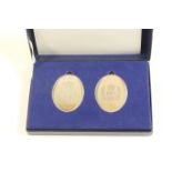 Queen Elizabeth II Silver Jubilee medallions, comprising two of oval form, each weighing 43g, 5.5cm,