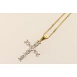 Diamond cross pendant necklace, set with eleven round brilliant cut diamonds, total diamond weight