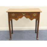 George III oak lowboy, circa 1800-20 with later restorations, fitted with a central short drawer