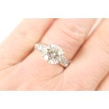 Diamond ring, round brilliant cut stone estimated as 2.69cts, colour L/M, clarity VS1-2, in a four