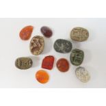 Small collection of six ancient Egyptian scarabs, and five intaglio engraved hardstone gems,