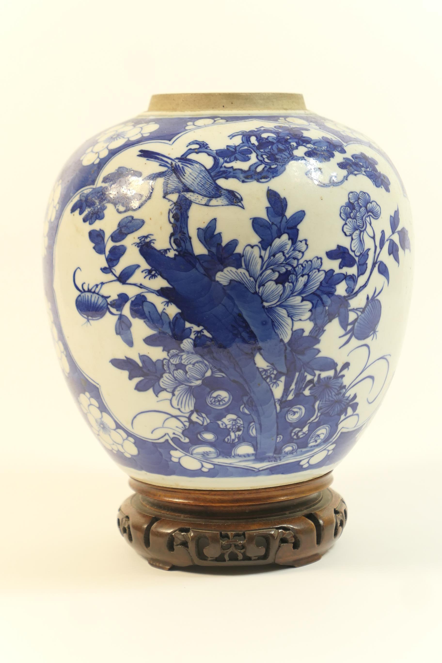 Chinese blue and white ginger jar, 18th or 19th Century, decorated with panels of birds amidst peony