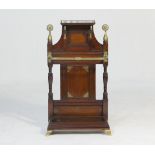 Attributed to James Shoolbred, a Victorian walnut and brass hall stand, having an upper shelf with