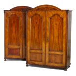 Pair of French walnut armoires, late 19th Century, each having an arched top with burr walnut