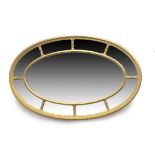Edwardian gilded oval wall mirror, circa 1900-10, central oval bevelled glass plate within a