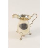 George V silver baluster cream jug, Birmingham 1928, Georgian style raised on stepped feet, height