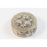 German 800 standard silver box, circular form with hinged cover, worked throughout with fruit,