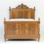 French walnut bed, in Louis XV style, having a panelled headboard with acanthus carved surmount,