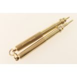 9ct gold propelling pencil, London 1926, with engine turned decoration and loop for suspension,