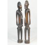 Pair of Senufo (Ivory Coast), wooden guardian figures, height 140cm
