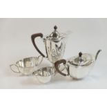 George V silver four piece tea service, Birmingham 1931/32, comprising teapot and footed hot water