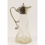 Edwardian wrythen moulded clear glass claret jug, with silver plated mount and hinged cover,