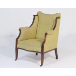 Late Victorian mahogany and upholstered armchair, upholstered throughout in light green corded