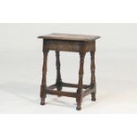 Oak joint stool, 18th Century, with later restorations, rectangular seat with moulded edge over a