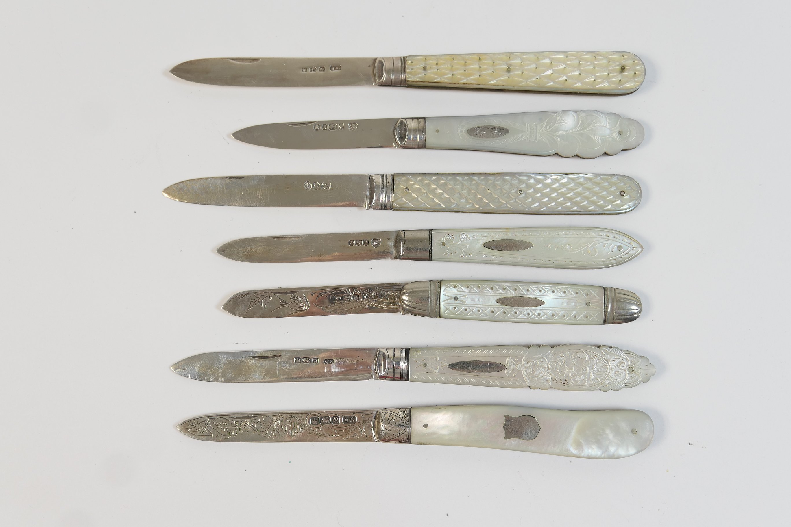 Small selection of silver and mother of pearl folding fruit knives including a Georgian example,