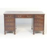 Mahogany twin pedestal desk, late 20th Century, the top with green leather inset over three frieze