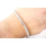 Diamond line bracelet in 18ct white gold, set with 52 round brilliant cut diamonds, each set