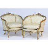 Pair of Italian giltwood and upholstered tub chairs, each in Baroque style with upholstered panelled
