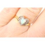 Opal and diamond cluster ring, centred with a heart shaped cabochon opal measuring approx. 5mm,