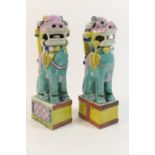 Pair of Chinese porcelain Dogs of Fo joss stick holders, decorated in bright colours, height 23cm