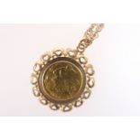 Edwardian half sovereign pendant necklace, the coin of 1903, mounted within a 9ct gold pendant