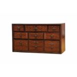 A nine-drawer Cabinet, walnut and oak, front of the drawers with Brazilian rosewood bands and