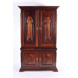 A Bookcase Cabinet, Brazilian rosewood, padded doors and sides, bronze mounts, Portuguese, 18th/19th