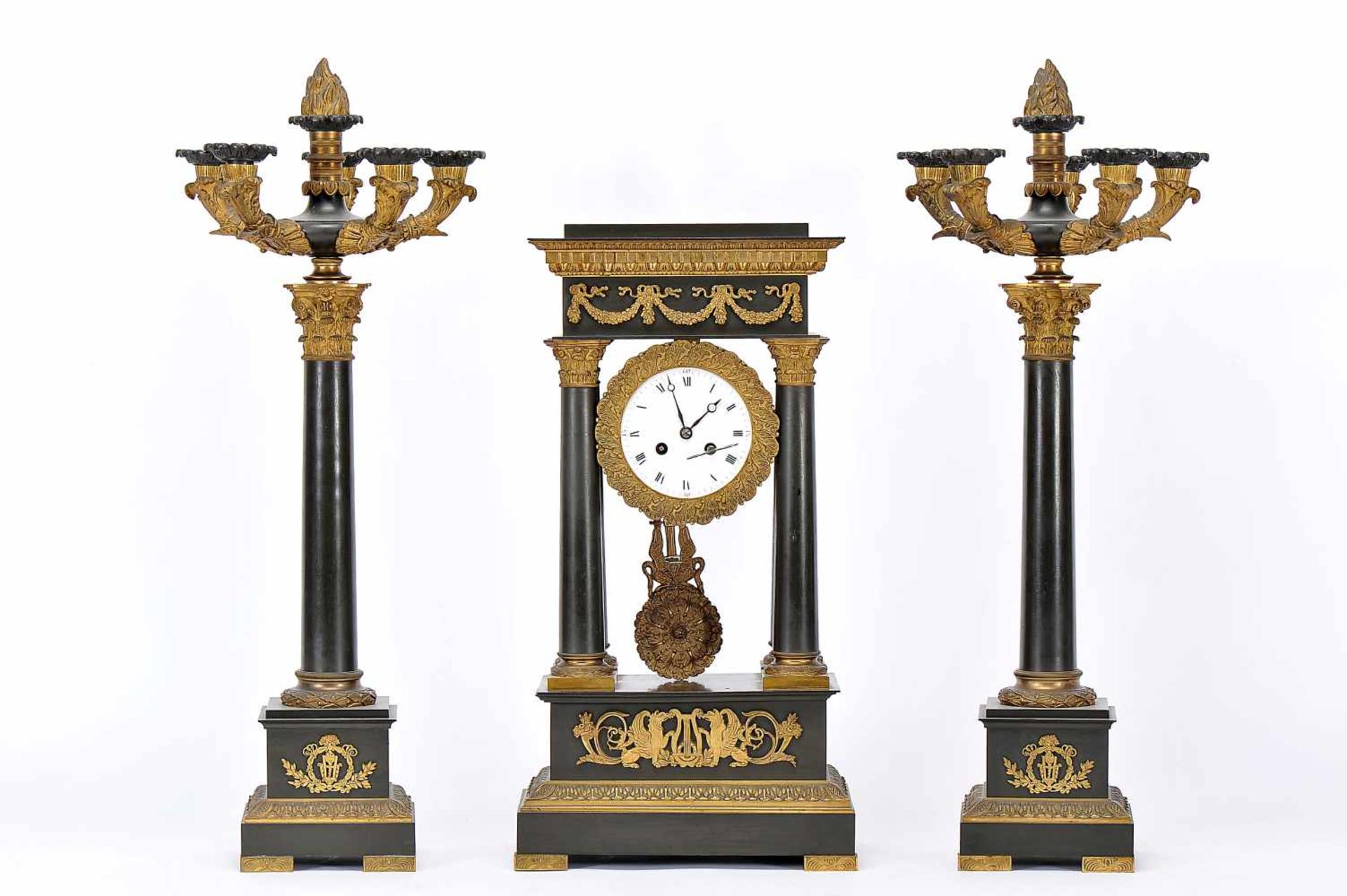 A Garniture - Gantry Clock and a pair of Six-light Candelabra, Empire manner, patinated bronze