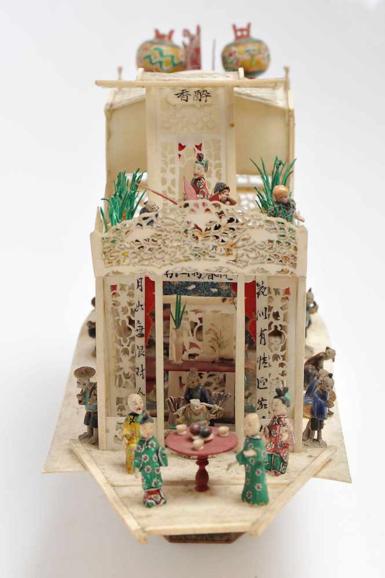 A Chinese Boat with Figures, set of ivory sculptures, pierced and partly polychrome decoration, - Bild 2 aus 2
