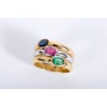 A Ring, 800/1000 tricolour gold, set with oval cut ruby with the approximate weight of 0.55 Ct.,