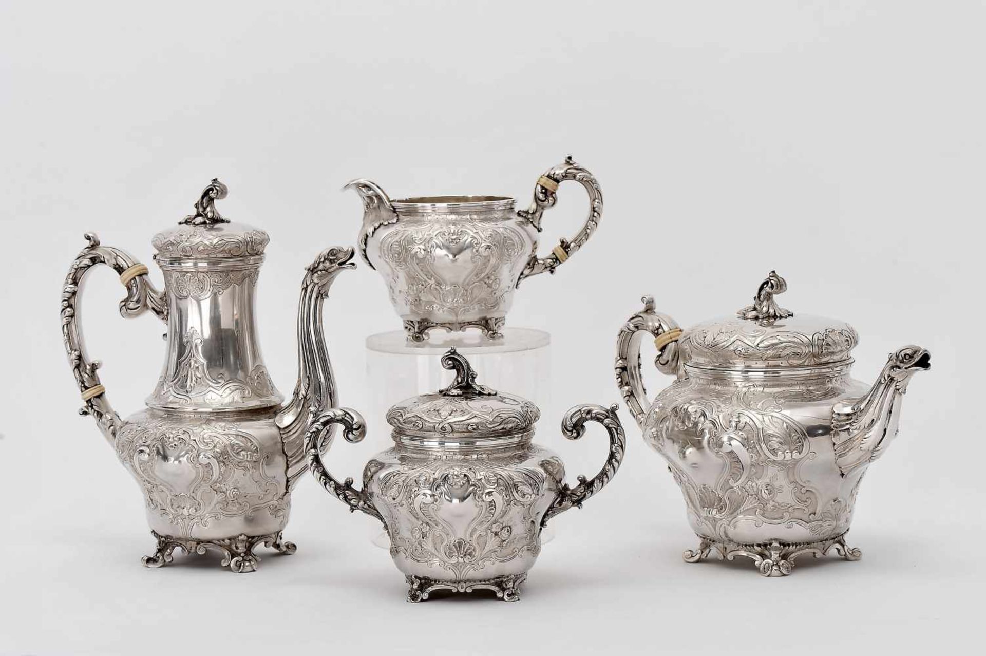 A Tea and Coffee Set, rocaille style, 916/1000 silver, repoussé decoration, consisting of teapot,