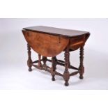 A Gate Leg Table with Two Drawers, Brazilian rosewood, multi-faceted edge top, turned legs and