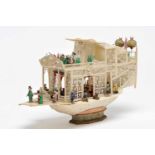 A Chinese Boat with Figures, set of ivory sculptures, pierced and partly polychrome decoration,