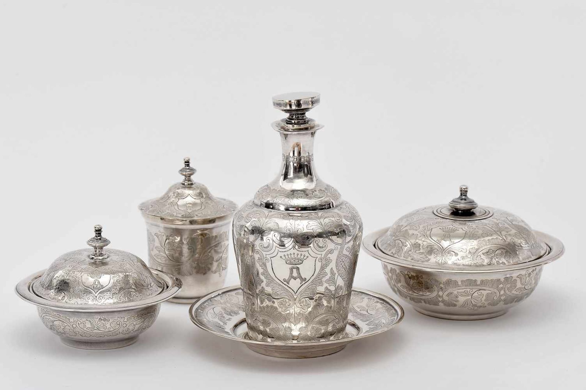 A Vanity Set, 833/1000 silver, consisting of three boxes and bottle with stand, engraved