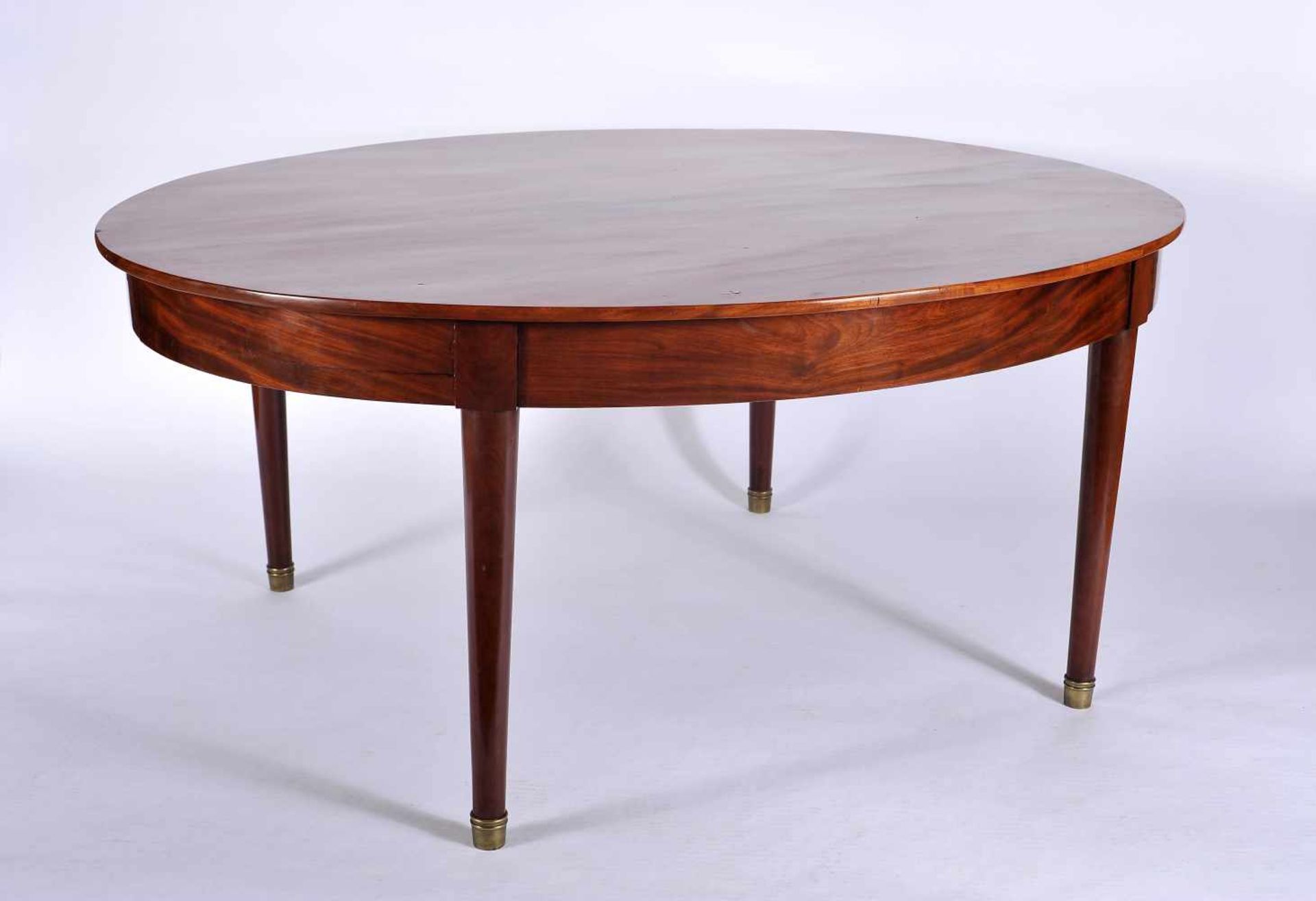 An Oval Table, mahogany, legs with bronze caps, European, 19th C., small restoration, Dim. - 72 x