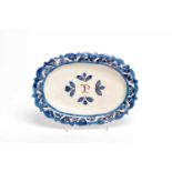 A Scalloped Platter, faience, blue and vinous "Beaded" decoration, central decoration with