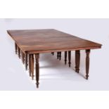 A Dining Room Table, sissoo, three extension boards, twenty gadrooned and retractable legs, Goa,