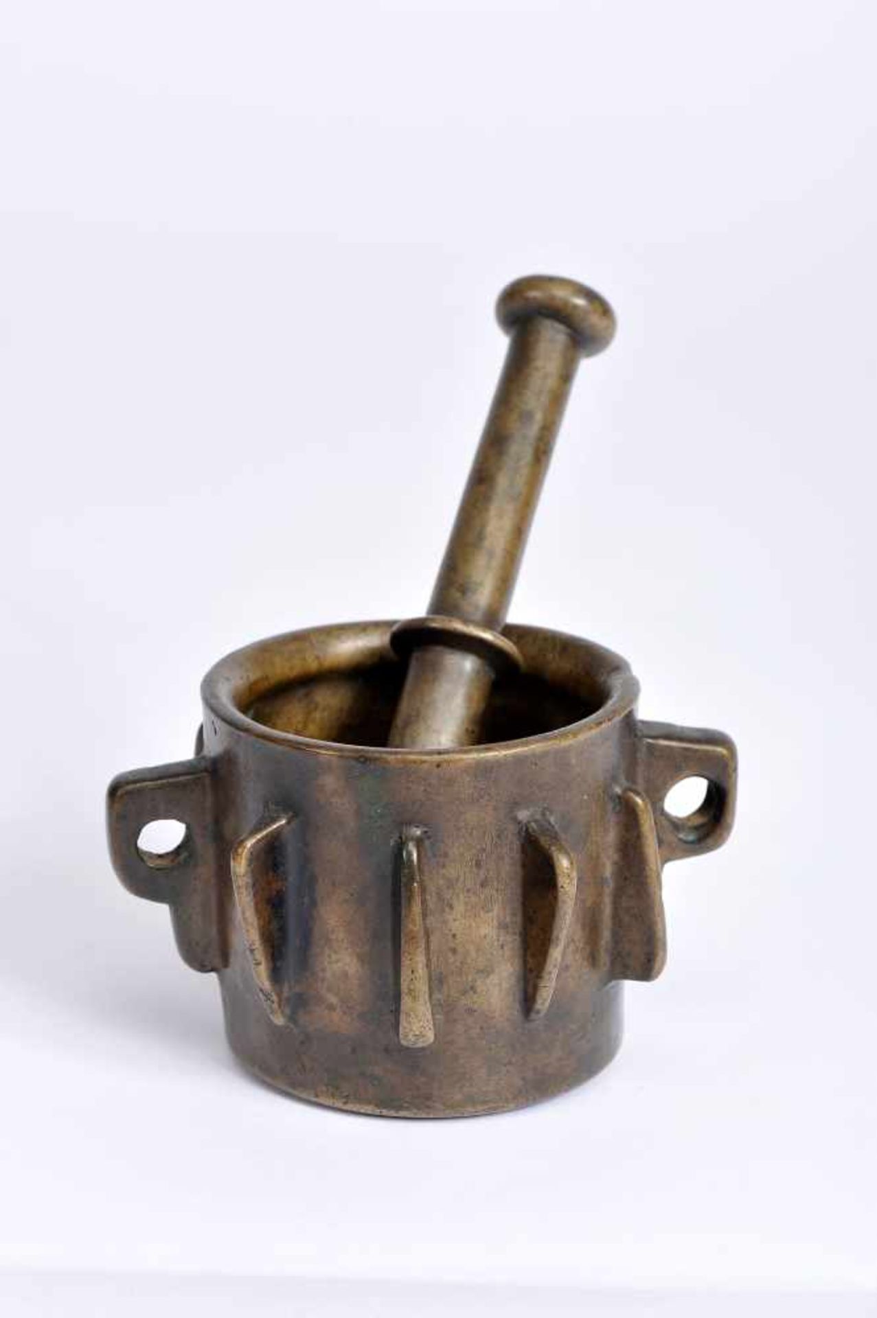 A Mortar with Pestle, gothic, bronze, ribbed decoration en relief, two spikes with holes for