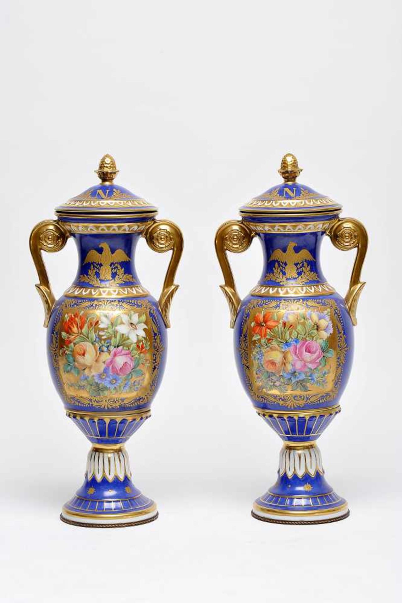 A Pair of Covered Urns, Sèvres porcelain, blue and gilt decoration "Eagle" and "N" (for Napoleon),