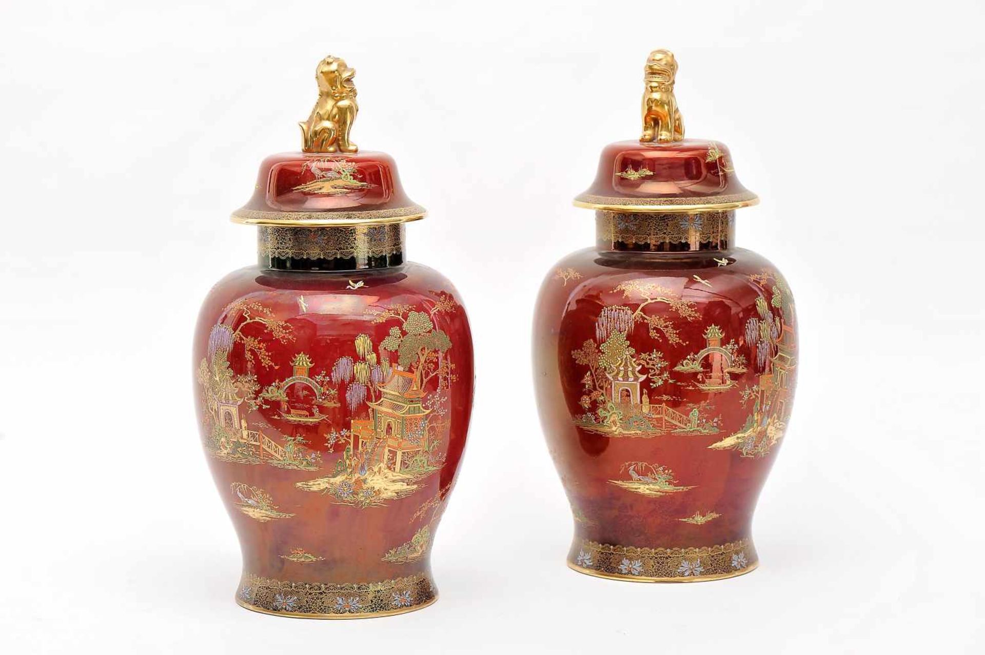 A Pair of Covered Pots, stone powder Carlton Ware, polychrome and gilt decoration on burgundy
