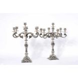 A Pair of Seven-light Candelabra, 833/1000 silver, engraved decoration en relief, Portuguese,