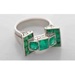 A Ring, 500/1000 platinum, set with 15 baguette cut emeralds and an emerald cut one (the largest one