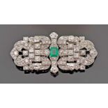 A Brooch/Double clip, Art Deco style, platinum and gold, set with emerald cut emerald with an
