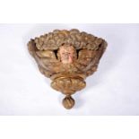 A Large Pedestal, carved, polychrome and gilt wood "Angel head", Portuguese, 18th C., faulst on